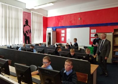 Students sitting at and using computers